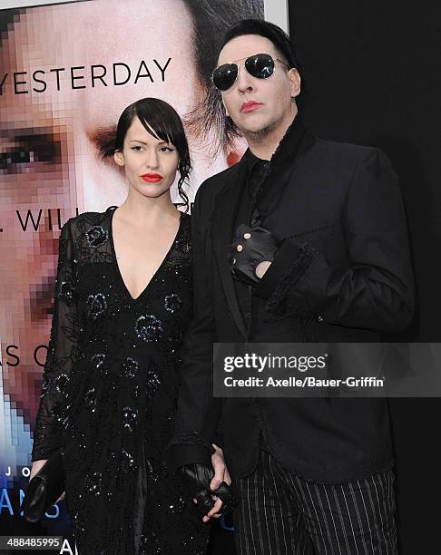 Musician Marilyn Manson and Lindsay Usich arrive at the Los Angeles premiere of 'Transcendence' at Regency Village Theatre on April 10, 2014 in...