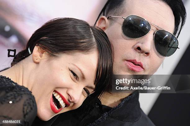 Musician Marilyn Manson and Lindsay Usich arrive at the Los Angeles premiere of 'Transcendence' at Regency Village Theatre on April 10, 2014 in...