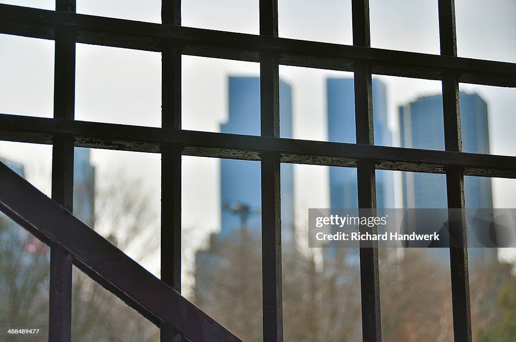 Buildings behind iron fence