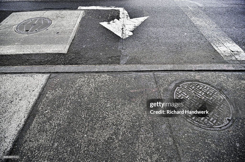 White arrow on asphalt