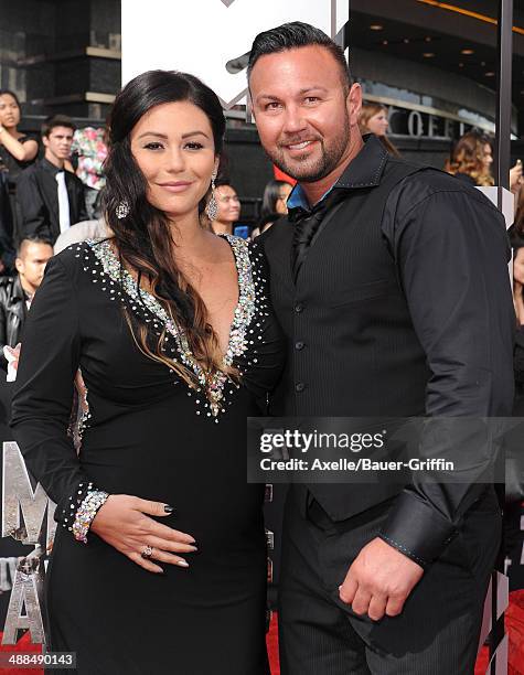 Personalities Jenni 'Jwoww' Farley and Roger Mathews arrive at the 2014 MTV Movie Awards at Nokia Theatre L.A. Live on April 13, 2014 in Los Angeles,...