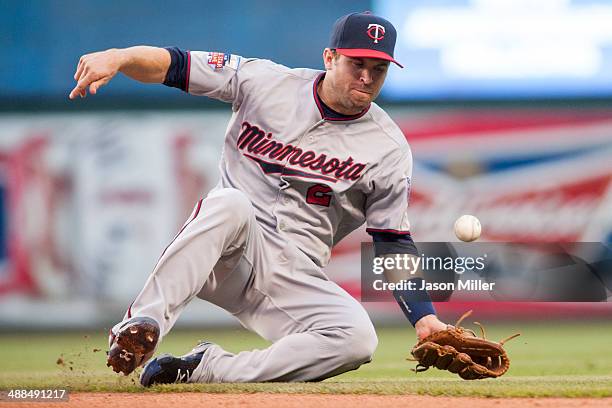 Second baseman Brian Dozier of the Minnesota Twins bobbles a ground ball hit by David Murphy of the Cleveland Indians during the third inning at...