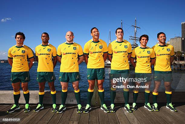 Wallaby squad members Matt Toomua, Kurtley Beale, Stephen Moore, Israel Folau, Dave Dennis, Nick Phipps and Christian Lealiifanu pose during the...