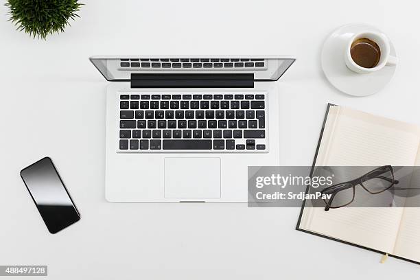 office desk - mac laptop stock pictures, royalty-free photos & images