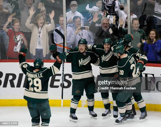 Jason Pominville, Zach Parise, Mikael Granlund, Jonas Brodin and Ryan Suter of the Minnesota Wild celebrate a goal by Granlund against the Chicago...