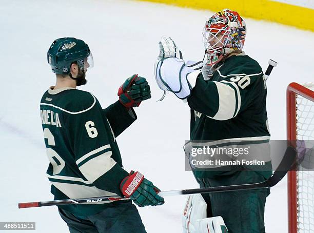 Marco Scandella and Ilya Bryzgalov of the Minnesota Wild celebrate a win of Game Three of the Second Round of the 2014 NHL Stanley Cup Playoffs...