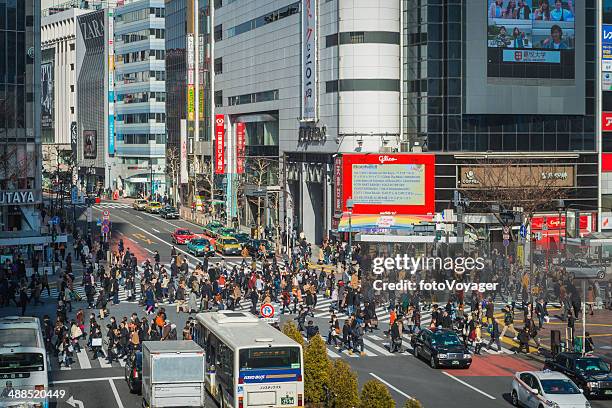 tokyo crowds of pedestrians traffic on famous shibuya crossing japan - now voyager stock pictures, royalty-free photos & images