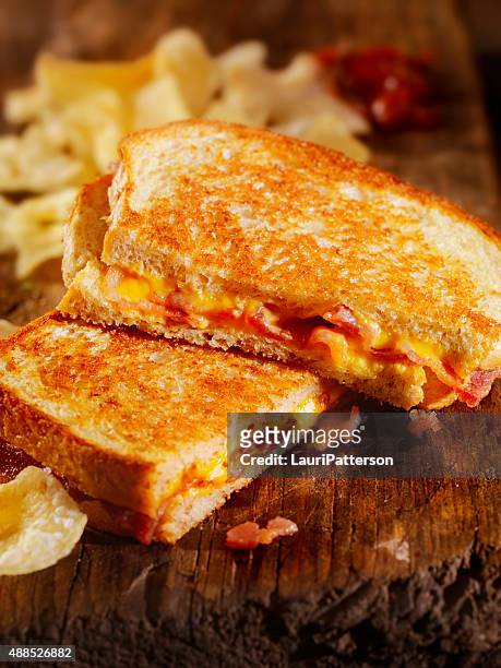 grilled cheese and bacon sandwich - grilled cheese stock pictures, royalty-free photos & images