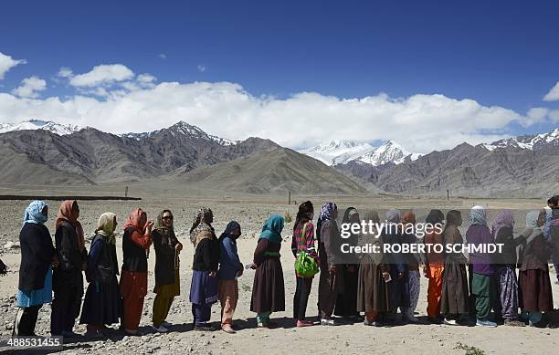 Indian voters line up to vote outside a small rural school in Shushot Yongma, a small enclave on the Indus river valley near the northern city of...