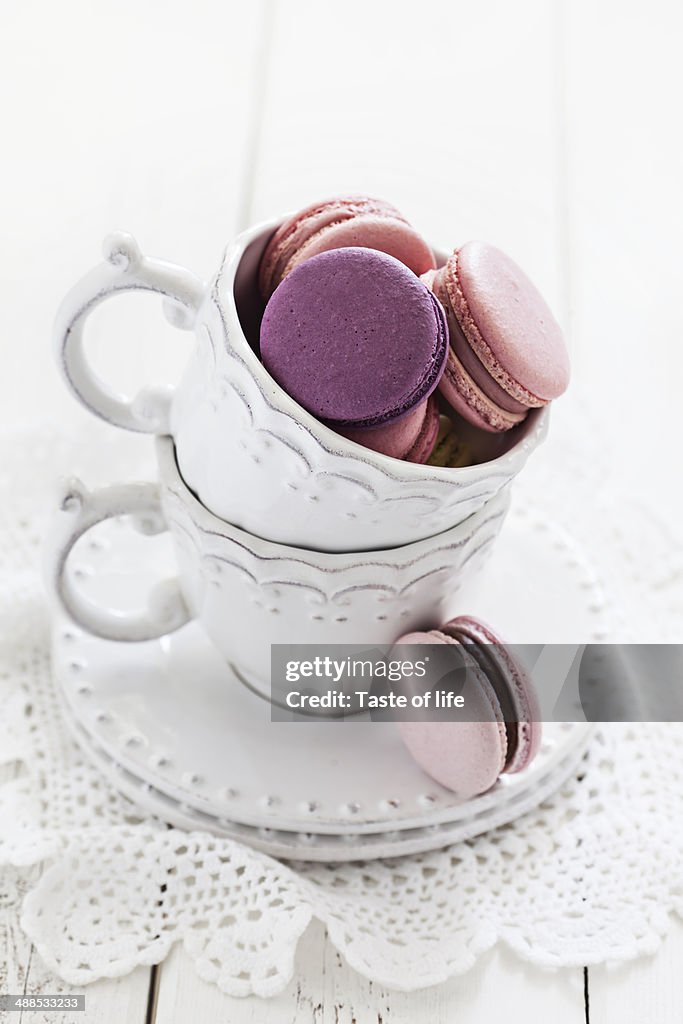 French macaroons in a white cup