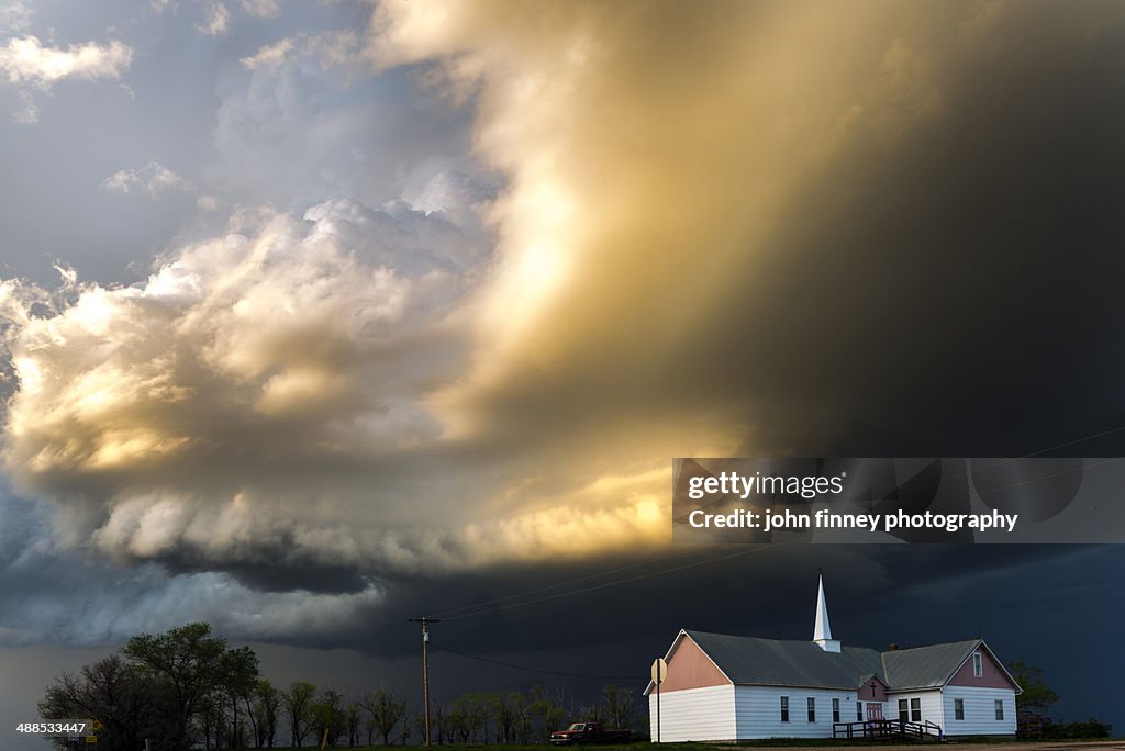 White church and black clouds