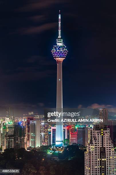 tower at night - menara kuala lumpur tower stock pictures, royalty-free photos & images