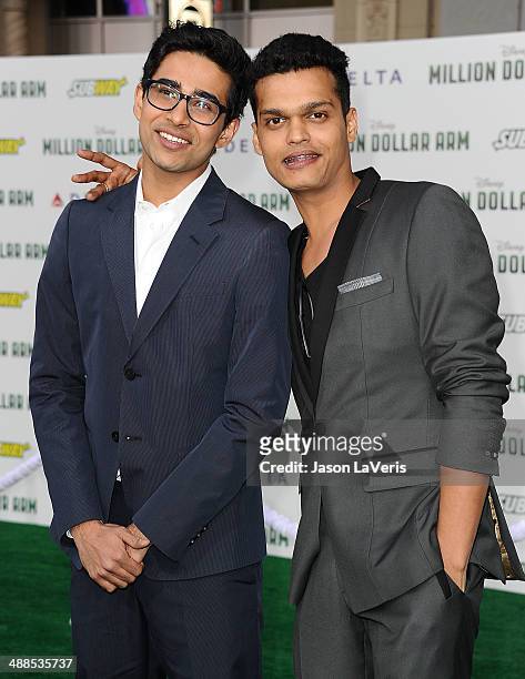 Actors Suraj Sharma and Madhur Mittal attend the premiere of "Million Dollar Arm" at the El Capitan Theatre on May 6, 2014 in Hollywood, California.