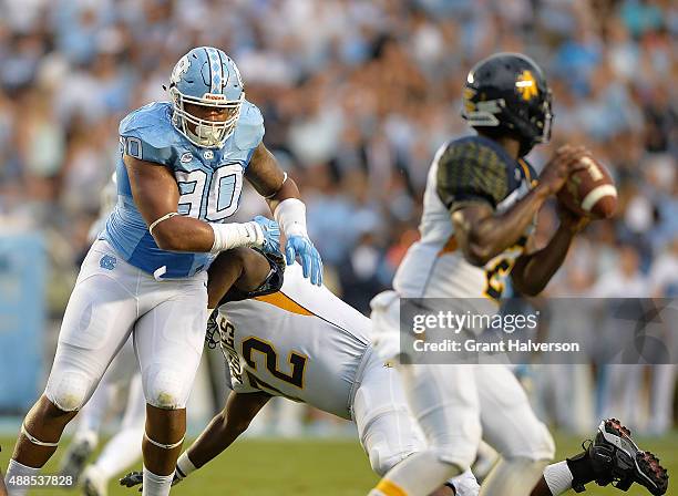 Nazair Jones of the North Carolina Tar Heels rushes the passer during their game against the North Carolina A&T Aggies at Kenan Stadium on September...