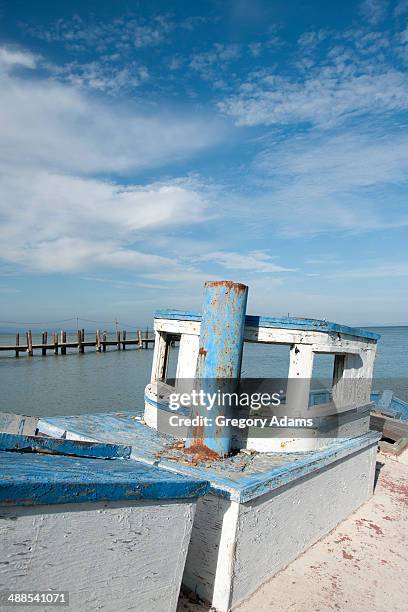 rusty weathered boat in front of a pier - san pablo bay ストックフォトと画像