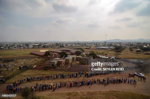 Voters queue at the Rakgatla High School voting station in Marikana, where residents reported waiting on line for more than four hours. South...