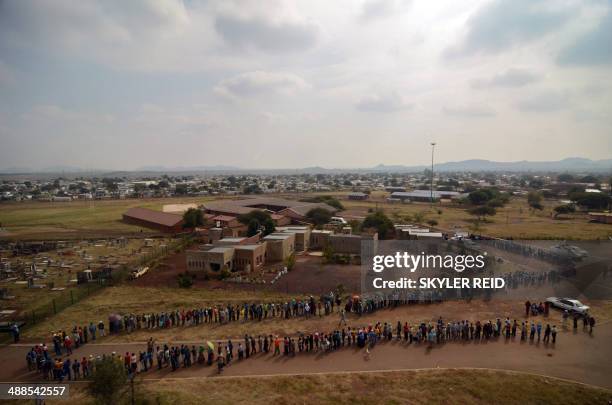 Voters queue at the Rakgatla High School voting station in Marikana, where residents reported waiting on line for more than four hours. South...