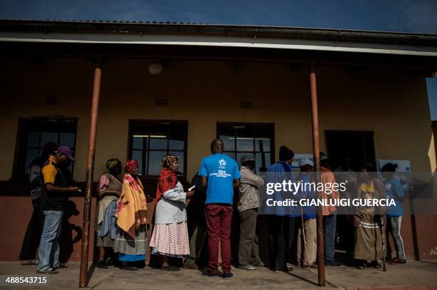 Residents of Qunu, the resting place of Nelson Mandela, wait in line to cast their ballot, on May 7, 2014 at the Qunu Junior Secondary school in...