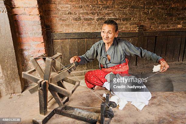 nepali woman spinning the wool - spinnrock bildbanksfoton och bilder