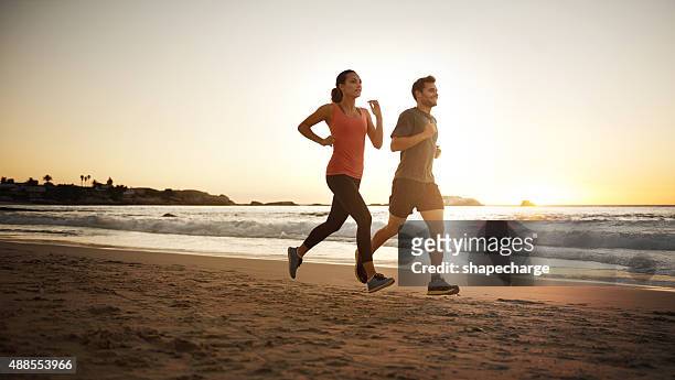 making their way towards fitness - jogging stock pictures, royalty-free photos & images