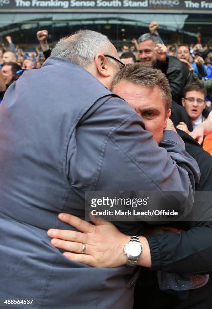 Large Birmingham fan embraces Birmingham manager Lee Clark as they celebrate after avoiding relegation following the Sky Bet Championship match...