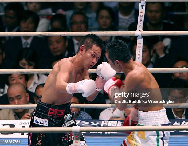 Katsunari Takayama of Japan exchanges punches with Shin Ono during the IBF minimumweight title bout between Katsunari Takayama of Japan and Shin Ono...