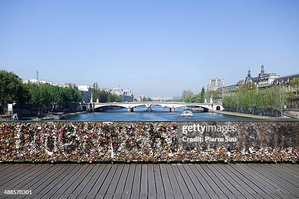 Love Padlocks on the Le Pont Des Arts bridge on May 7, 2014 in Paris, France. In recent years Le Pont Des Arts has attracted tourists who visit the...