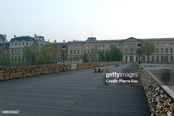 Love Padlocks on the Le Pont Des Arts bridge on May 7, 2014 in Paris, France. In recent years Le Pont Des Arts has attracted tourists who visit the...