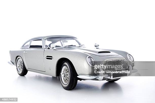 aston martin db5 model on white - james bond fictional character stock pictures, royalty-free photos & images