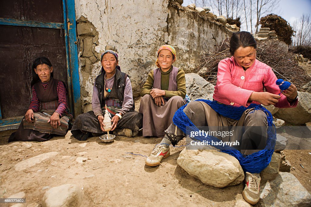 Tibetan women spinning wool in Mustang region