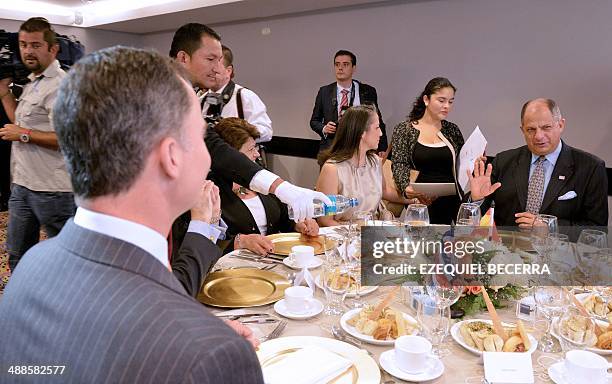 Costa Rica's president elect Luis Guillermo Solis and Spanish Prince Felipe of Borbon have breakfast together at Felipe's hotel in San Jose, on May...