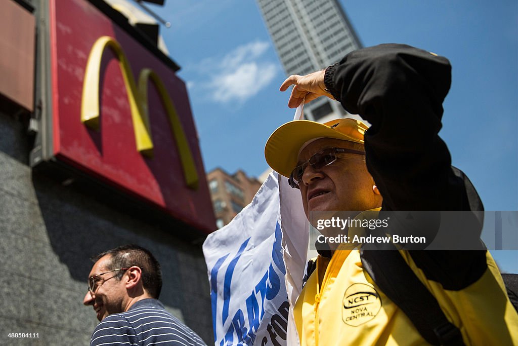 Protesters lobby for higher wages for fast food workers and urge fast ...