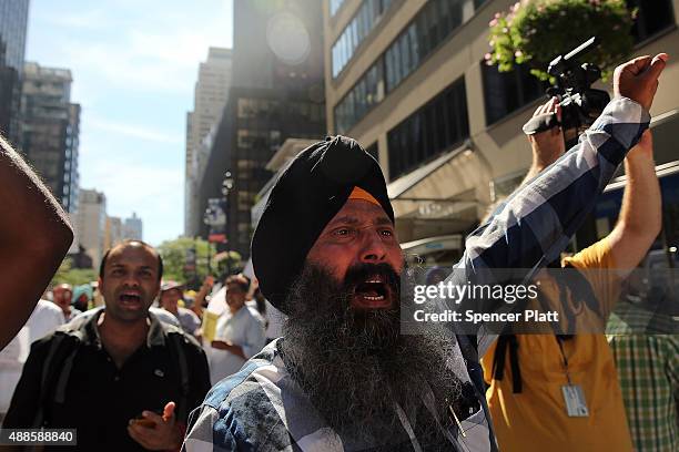 New York City taxi drivers hold a rally in front of Governor Andrew Cuomo's office to protest against recent inroads made by the Uber car service on...