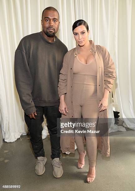 Kanye West and Kim Kardashian West attend Kanye West Yeezy Season 2 during New York Fashion Week at Skylight Modern on September 16, 2015 in New York...