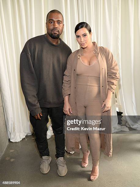 Kanye West and Kim Kardashian West attend Kanye West Yeezy Season 2 during New York Fashion Week at Skylight Modern on September 16, 2015 in New York...