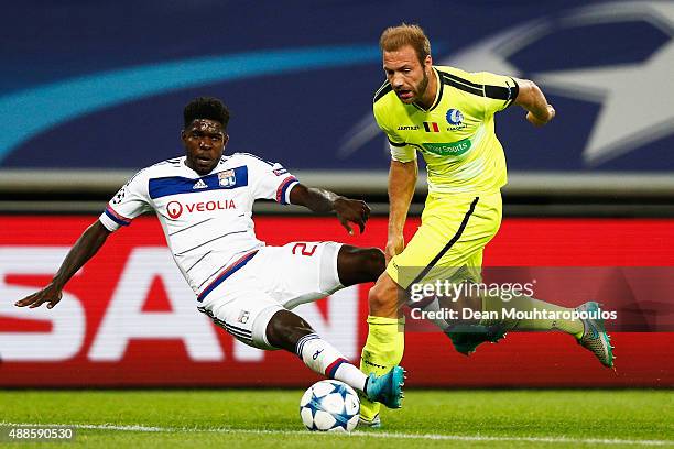 Laurent Depoitre of Gent battles for the ball with Samuel Umtiti of Lyon during the UEFA Champions League Group H match between KAA Gent and...