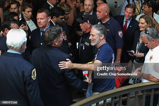 Comedian Jon Stewart talks with first responders while visiting the U.S. Capitol to demand that Congress extend the Zadroga 9/11 health bill...