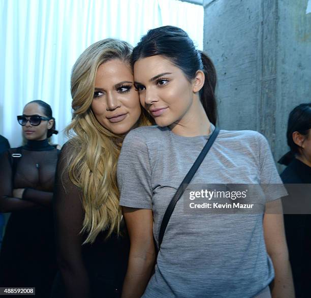 Khloe Kardashian and Kendall Jenner attend Kanye West Yeezy Season 2 during New York Fashion Week at Skylight Modern on September 16, 2015 in New...