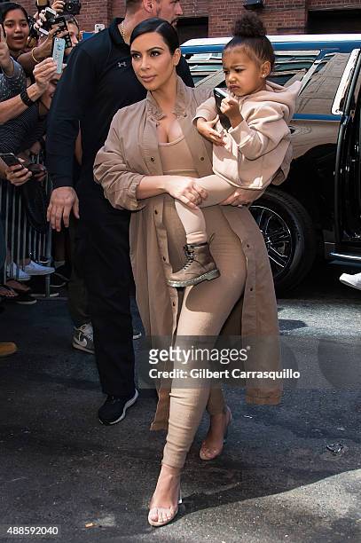 Kim Kardashian West and her daughter North West are seen arriving at Kanye West Yeezy Season 2 during Spring 2016 New York Fashion Week at Skylight...