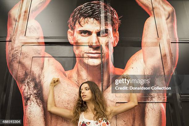 Actress Angela Sarafyan poses for a portrait in front of a large mural on Hollywood Boulevard on August 28, 2015 in Los Angeles, California.