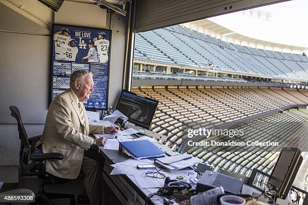 Radio announcer Vin Scully poses for a poses for a portrait in his studio booth on July 29, 2015 at Dodger Stadium in Los Angeles, California.