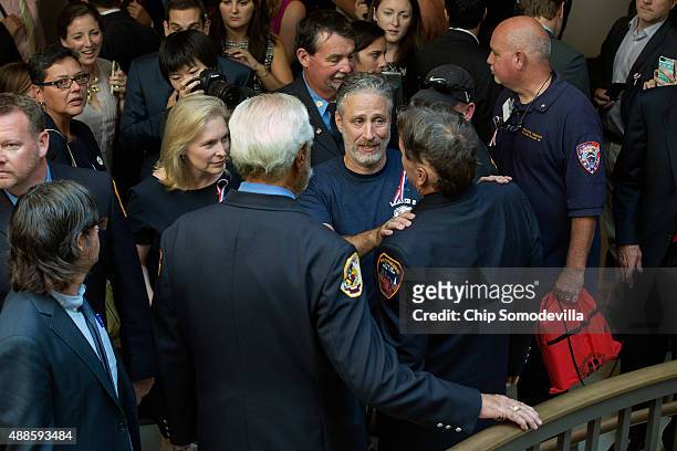 Comedian Jon Stewart talks with first responders while visiting the U.S. Capitol to demand that Congress extend the Zadroga 9/11 health bill...