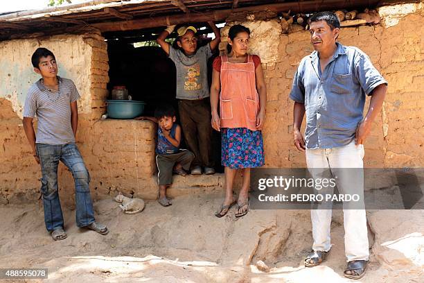Relatives of Leonel Castro, one of the 43 missing students, stay at the entrance of their home in Los Magueyitos village, in Tecoanapa, Guerrero...