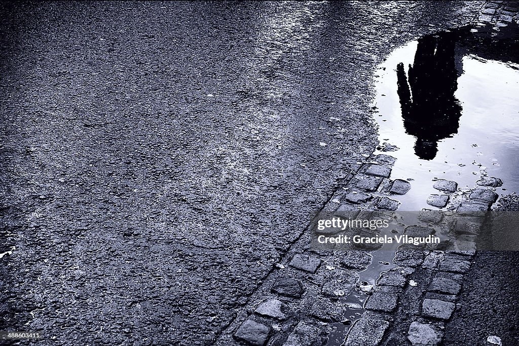 Reflection of a man in a pool