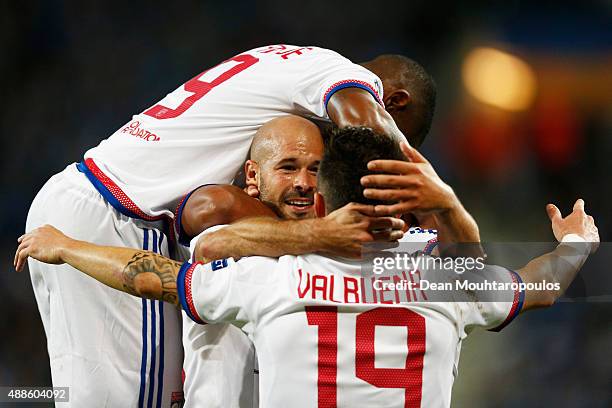 Christophe Jallet of Lyon celebrates scoring his teams first goal of the game with team mates during the UEFA Champions League Group H match between...