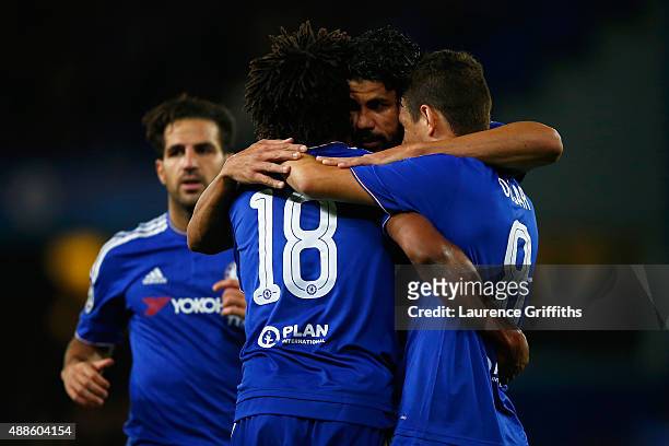 Diego Costa of Chelsea celebrates scoring their third goal with Loic Remy and Oscar of Chelsea during the UEFA Chanmpions League group G match...