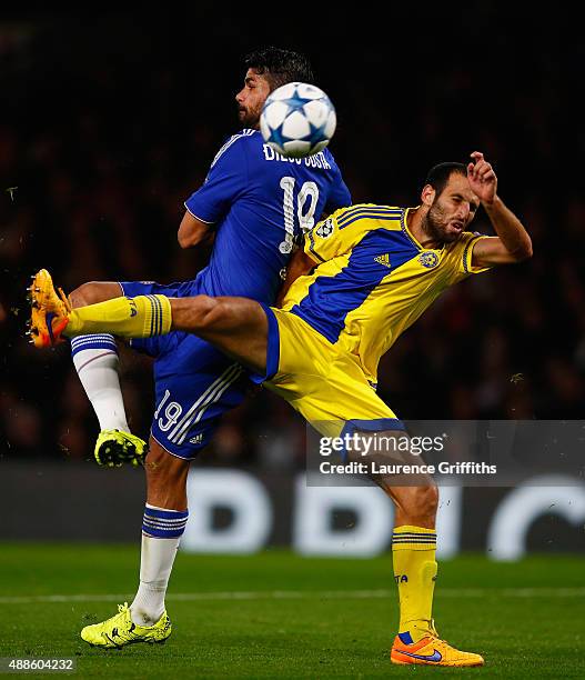 Diego Costa of Chelsea scores their third goal under pressure from Yuval Shpungin of Maccabi Tel Aviv during the UEFA Chanmpions League group G match...