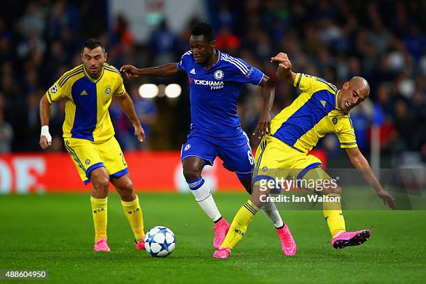 Baba Rahman of Chelsea is tackled by Tal Ben Haim II of Maccabi Tel Aviv during the UEFA Chanmpions League group G match between Chelsea and Maccabi...