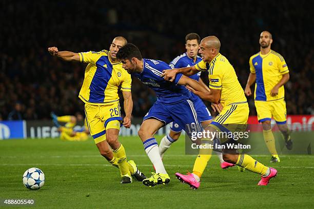 Diego Costa of Chelsea is closed down by Tal Ben Haim I of Maccabi Tel Aviv and Tal Ben Haim II of Maccabi Tel Aviv during the UEFA Chanmpions League...