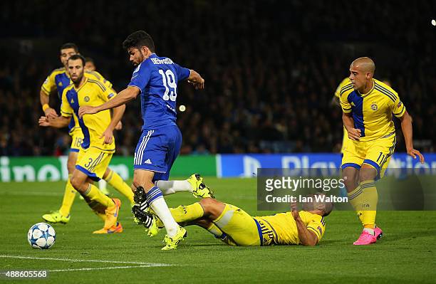 Diego Costa of Chelsea draws a foul in the penalty area from Tal Ben Haim I of Maccabi Tel Aviv during the UEFA Chanmpions League group G match...